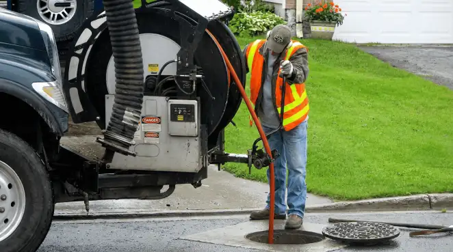 Technician using specialized drainage equipment for sewer line cleaning and foundation protection in Stockton, CA