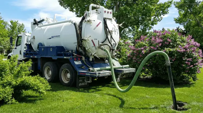 Professional vacuum truck performing residential drainage and septic maintenance in Stockton, CA